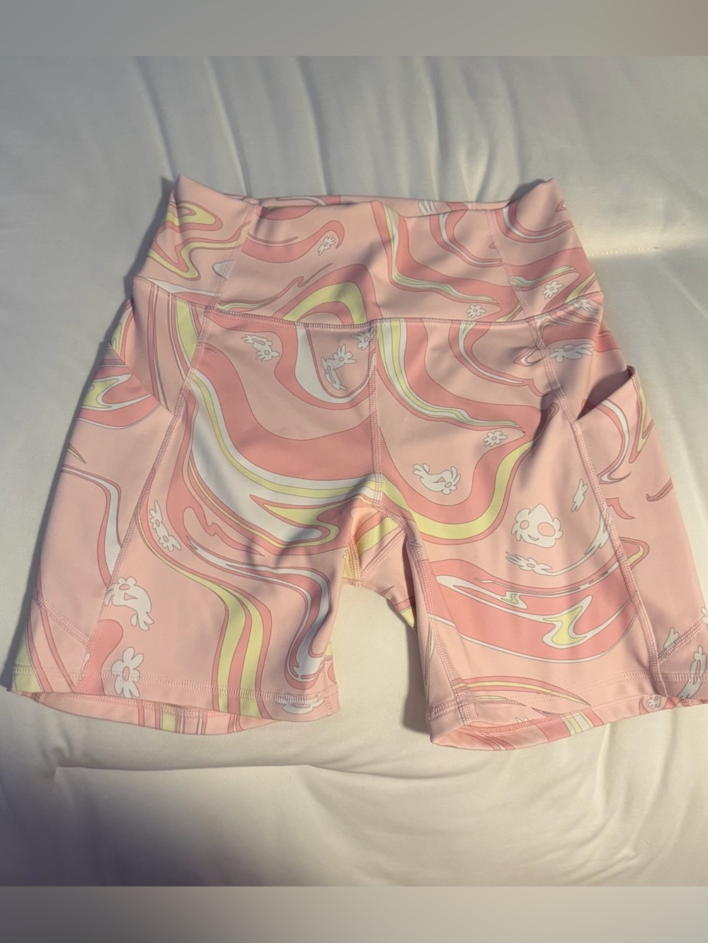 Fabletics Pink Swirl High-Rise Bike Shorts with Yellow & White Accents